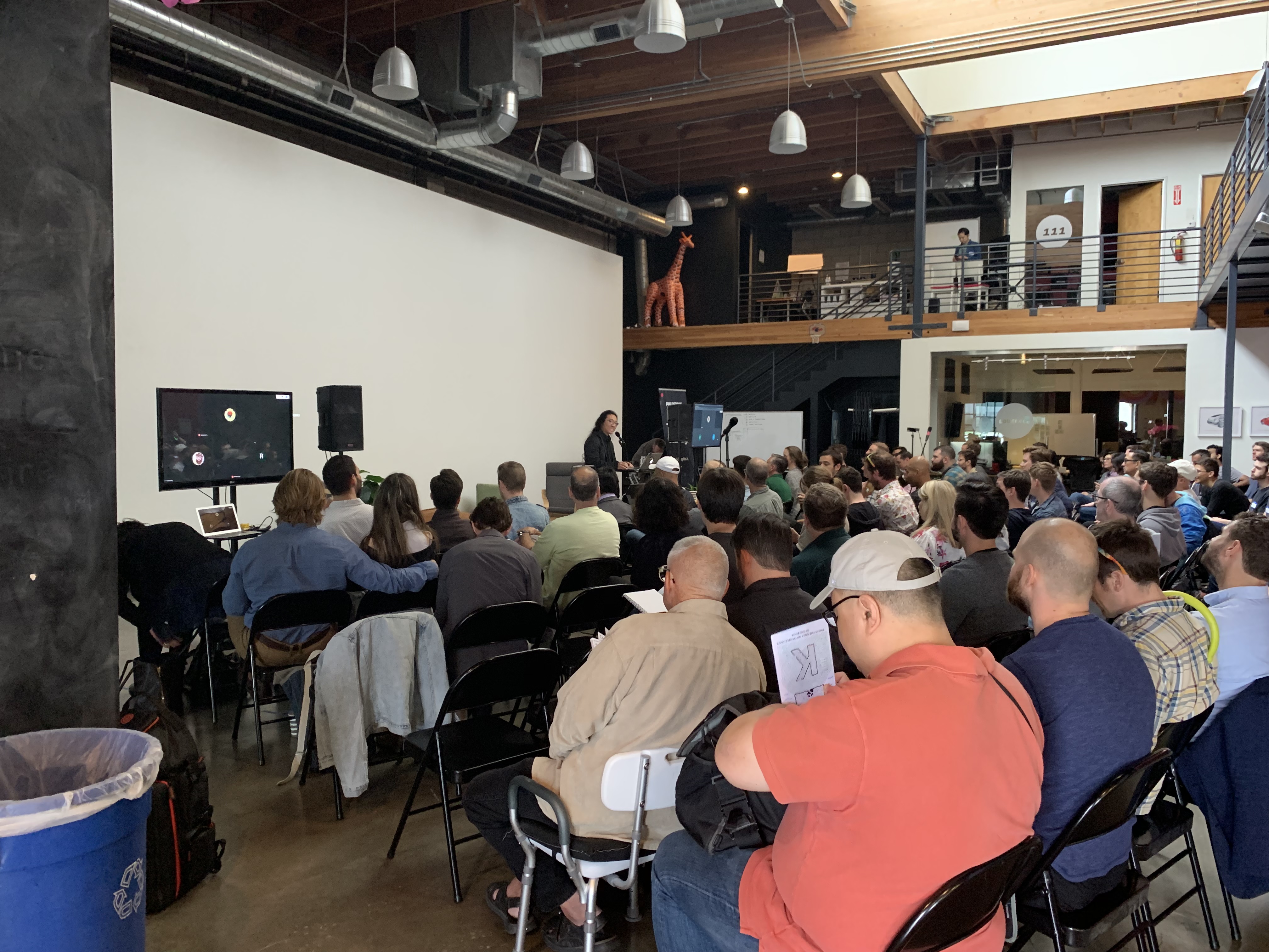 Refactor Camp 2019 main hall, giraffe on mezzanine