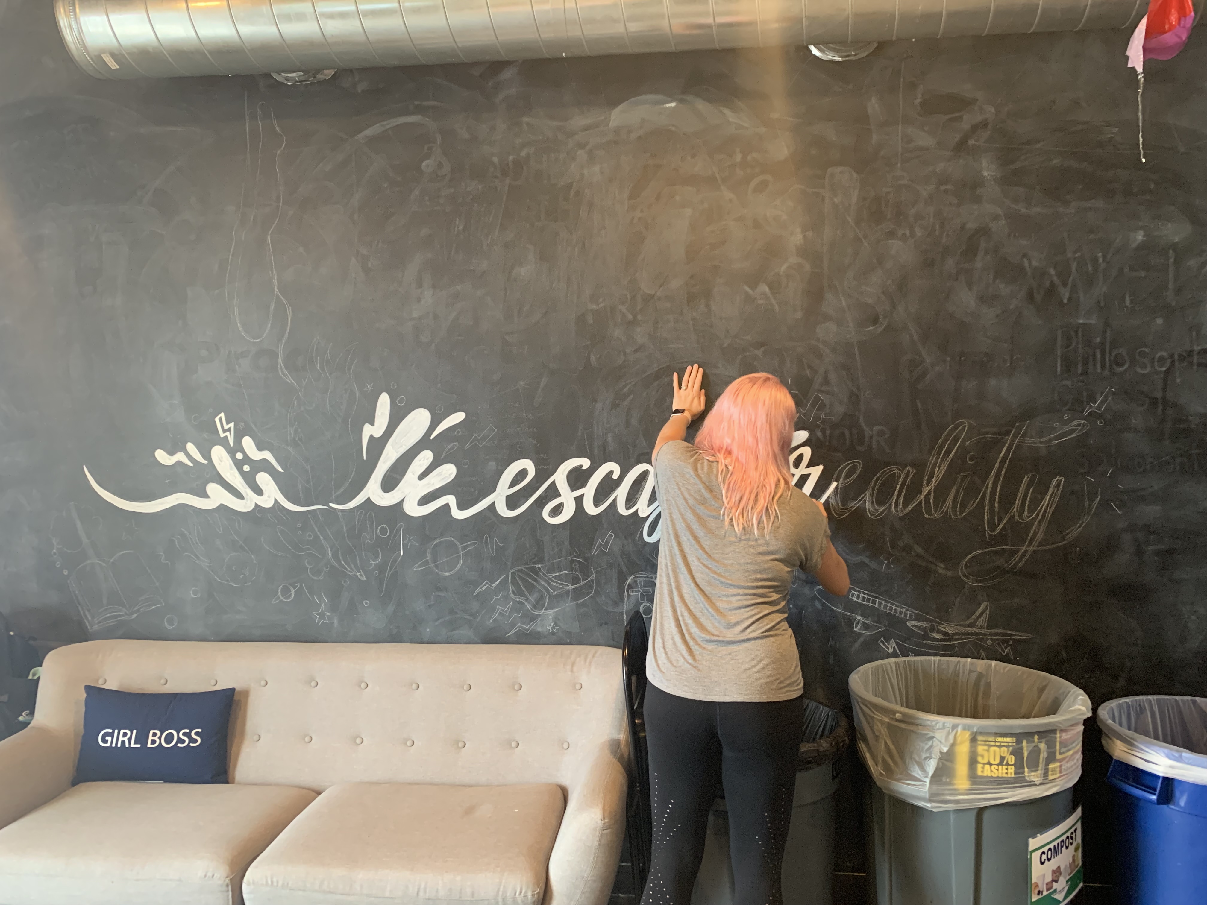 Gracie Wilson drawing the escape reality chalk mural